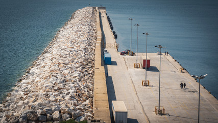 cement and stones straight breakwater long line structure