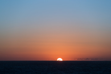 Sun going down in the ocean in the North Sea.