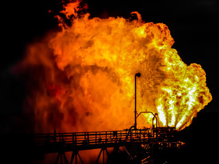 An oil semi submersible rig flaring gas to check the oil well.