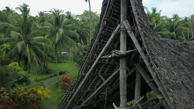 Aerial view descending shot, exterior view of Haus Tambaran spirit house in Kanganaman Village, Sepik Region, Papua New Guinea
