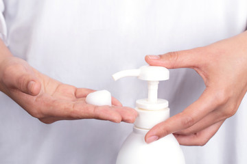 Hand press Pure white plastic pump bottle and other hand take cleaner foam.hygiene to stop spreading coronavirus.