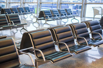 Waiting room at the airport with empty seats. The empty hall of the airport during an outbreak of the virus COVID-19 Pandemic virus
