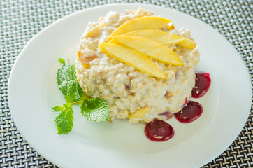 Healthy eating Oatmeal porridge with mango and mint