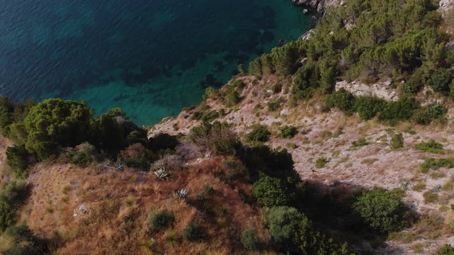 Beautiful aerial view of mountains and sea, paradise Ieranto bay. Marine Park. Trail for active sports, hiking along the mountain to a wild beach, tourist destination. Nerano, Massa Lubrense, Italy