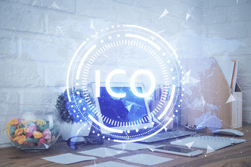 Multi exposure of blockchain and crypto economy theme hologram and table with computer background. Concept of bitcoin cryptocurrency.