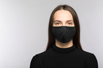 Stop coronavirus infection. The girl in the mask.
