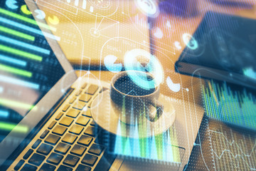 Double exposure of desktop computer and technology theme hologram. Concept of software development.