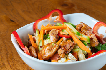 Caesar salad - vegetable salad with roast chicken meat