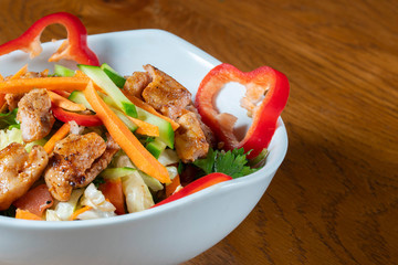 Caesar salad - vegetable salad with roast chicken meat