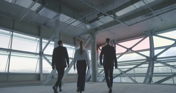 Real estate agent and businessmen making business deals for new office space