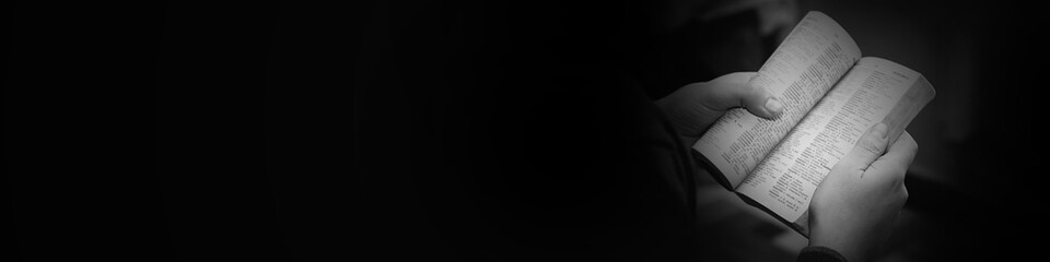 Businessman holding book black and white