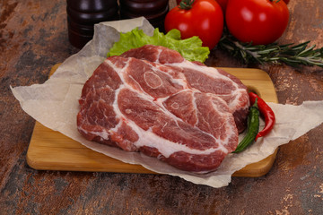 Raw pork neck steak