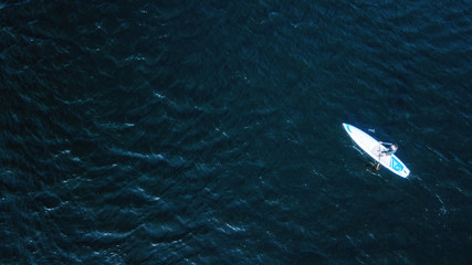 Obraz premium athlete kayaks on the river . Travel or kayaking concept. Drone shot, aerial view, picture with place for your text