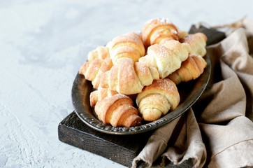 Bagels of cottage cheese on a metal vintage platter on a gray background
