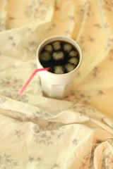     Go to Page|12345...24Next  Glass of soda with ice and straw on a bed. Selective focus.