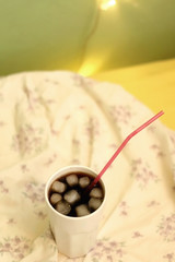     Go to Page|12345...24Next  Glass of soda with ice and straw on a bed. Selective focus.