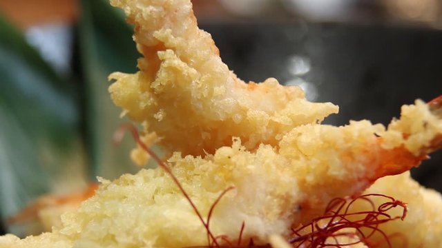Shrimp tempura or fried shrimp put on a rotating  dish