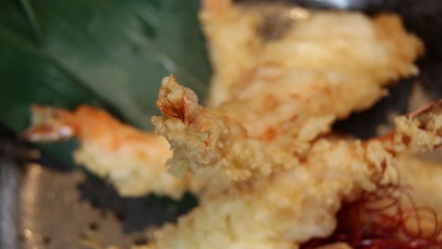 Shrimp tempura or fried shrimp put on a rotating  dish