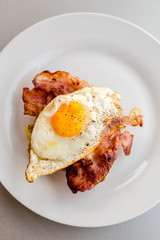 close up of avocado toast for breakfast with fried egg