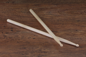 pair of drum sticks on wood surface