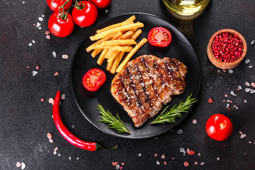 Ribeye steak with potatoes, onions and cherry tomatoes