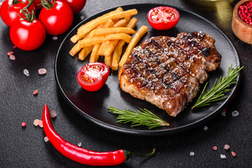 Ribeye steak with potatoes, onions and cherry tomatoes