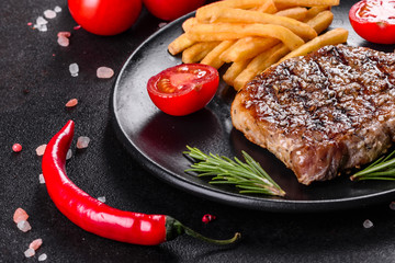 Ribeye steak with potatoes, onions and cherry tomatoes