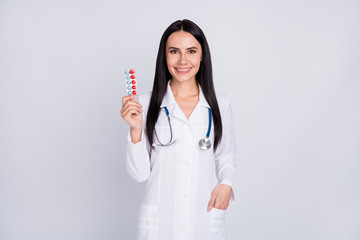 Photo of beautiful professional doc lady proposing best pills vitamin c prophylactic winter tablets wear stethoscope white lab coat isolated grey color background