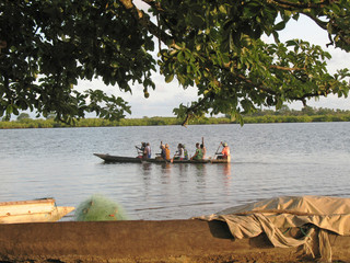 Transport of people through the Casamance river in the early hours of the day, Ziguinchor, Senegal,...