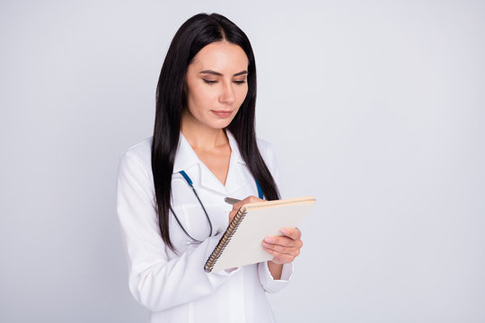 Photo of beautiful professional doc lady writing patient insurance medical prescription paper personal planner wear stethoscope white lab coat isolated grey color background