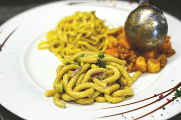 Passatelli, pasta made with bread and Parmigiano Reggiano cheese