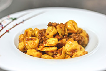 Tortellini with Bolognese sauce, Italian pasta, 