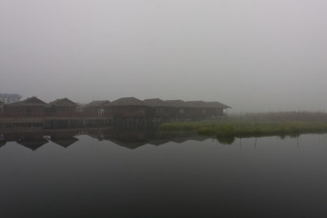 A hotel on the Inle Lke on a foggy winter morning, Myanmar