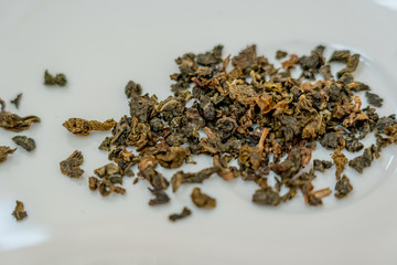 Closeup macro view of dried leaves of green tea