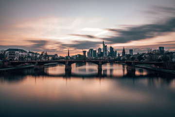 sunset over main river and Frankfurt skyline 