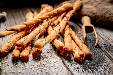 Bread sticks on a wooden background. Healthy food
