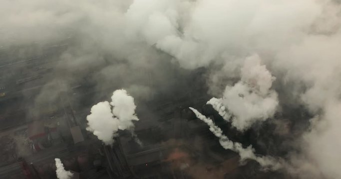 Top view of the metallurgical plant. Smoke coming out of factory pipes. ecology.