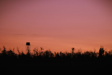 Silhouette of a Guard tower against the evening sky