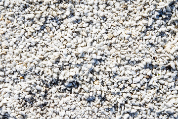 small white and gray stones, texture background, relief surface