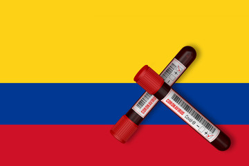 Test tubes with the Inscription 2019-nCoV on the background of the Colombia Flag. 3D Rendering