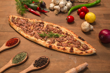 Pita from turkish cuisine on the wooden board