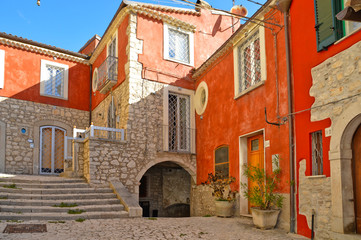 Fototapeta na wymiar A narrow street between the houses of Morcone, a medieval village in the Campania region in Italy