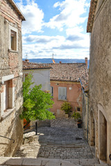 A narrow street between the houses of Morcone, a medieval village in the Campania region in Italy