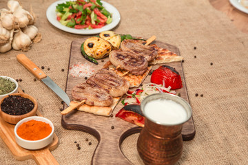 Barbecue, grilled meat on wood table, saslik stock photo