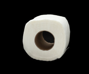 A white toilet roll is isolated on a black background.