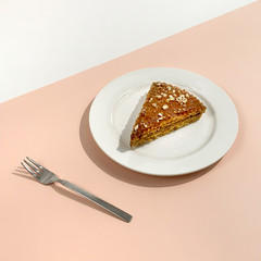 Waffle and caramel or condensed milk cake on white pink background