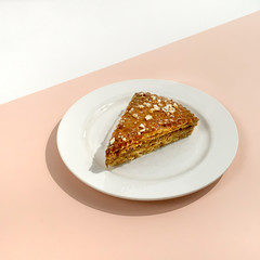 Waffle and caramel or condensed milk cake on white pink background