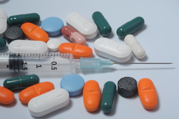 tablets in capsules - medicines, drugs with money  -  search for drugs and vaccine to combat Coronavirus n-cov19