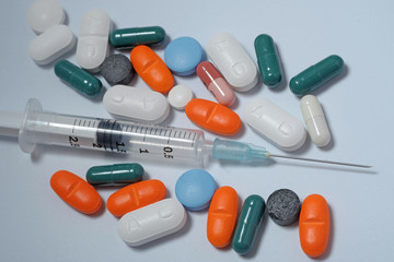 tablets in capsules - medicines, drugs with money  -  search for drugs and vaccine to combat Coronavirus n-cov19