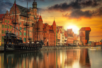 Beautiful old town with historical port crane in Gdansk over Motlawa river at sunset, Poland. © Patryk Kosmider